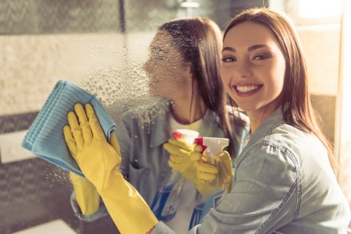 Cleaner wearing PPE while working safely in Knightsbridge